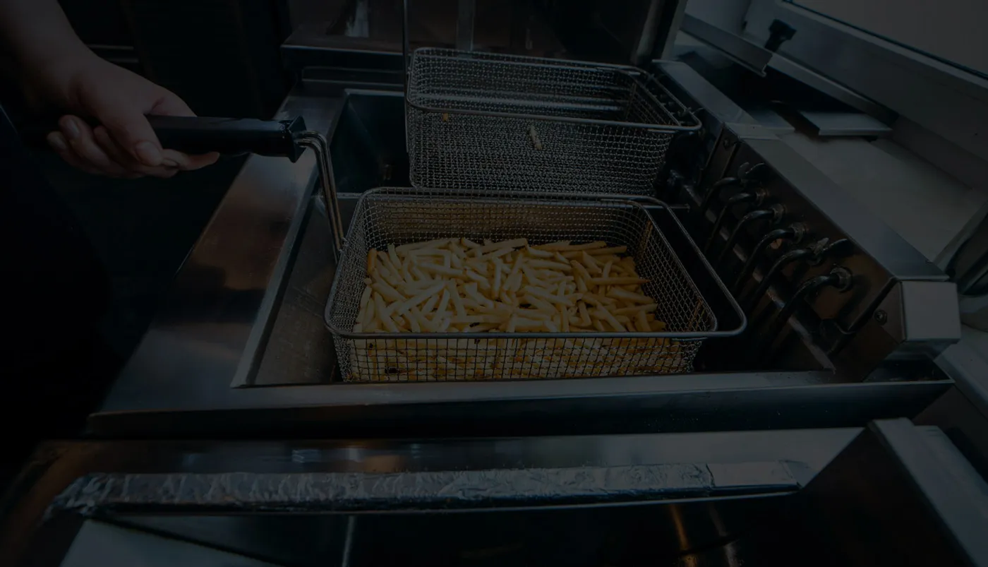 French fries in commercial fryer baskets